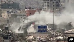 Image shows shelling of the Al-Qaboun neighborhood in rural Damascus, Syria, July 15, 2013. 