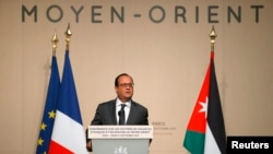 French President Francois Hollande delivers a speech at the opening of a one-day UN conference to find ways to help minorities in the Middle East persecuted by Islamic State militants, in Paris, Sept. 8, 2015.