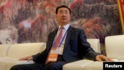 Wang Jianlin, chairman of Chinese property developer Dalian Wanda Group, sits in a meeting room as he arrives for the launch ceremony for the Qingdao Oriental Movie Metropolis on the outskirts of Qingdao September 22, 2013.