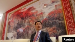 Wang Jianlin, chairman of Chinese property developer Dalian Wanda Group, sits in a meeting room as he arrives for the launch ceremony for the Qingdao Oriental Movie Metropolis on the outskirts of Qingdao September 22, 2013.
