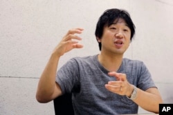 Japan Emoji creator Shigetaka Kurita speaks during an interview at his office in Tokyo.