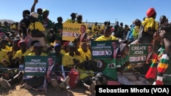 Members of Zanu PF rally in Mutoko, about 200km east of Harare displaying to President Emmerson Mnangagwa on June 9, 2018 what they want him address if he wins the July 30 Zimbabwe general election.