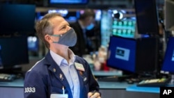 Trader Robert Charmak works on the floor on Jan. 24, 2022, in this photo provided by the New York Stock Exchange,