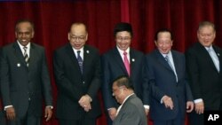 Association of Southeast Asian Nations, or ASEAN Foreign Ministers from left, K. Shanmugam of Singapore, Surapong Tovichakchaikul of Thailand, Pham Bihn Minh of Vietnam, Hor Namhong of Cambodia and Lim Jock Seng of Brunei wait for their counterpart from M