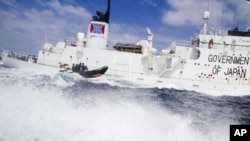 A small boat from the Sea Shepherd vessel, Steve Irwin, makes a reconnaissance trip past the Japanese whaling ship the Shonan Maru #2 near Freemantle in this handout picture released to Reuters on January 8, 2012. 