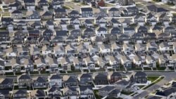 FILE - Rows of homes are shown outside Salt Lake City, April 13, 2019. The numbers show people continue to move to the South and West from the Midwest and Northeast. (AP Photo/Rick Bowmer, File)