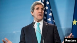 U.S. Secretary of State John Kerry makes a statement at a joint news conference with Germany's foreign minister (not pictured) at Berlin Tegel Airport, Jan. 31, 2014. 