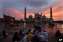 FILE - Indian Muslims break their Ramadan fast in New Delhi, India. There is strong opposition to reform of the divorce law from clerics and influential Muslim organizations.