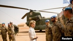 FILE - German Defense Minister Ursula von der Leyen speaks to German army Bundeswehr soldiers during a visit to Camp Castor in Gao, Mali, Dec. 19, 2016. 