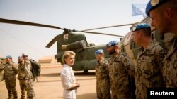 FILE - German Defense Minister Ursula von der Leyen speaks to German army Bundeswehr soldiers during a visit to Camp Castor in Gao, Mali, Dec. 19, 2016. 