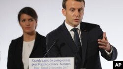 French President Emmanuel Macron speaks as French Junior Minister for Gender Equality Marlene Schiappa, listens during a ceremony for the International Day for the Elimination of Violence Against Women, Nov. 25, 2017 in Paris.