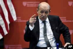 FILE - French Foreign Affairs Minister Jean-Yves Le Drian speaks at the Kennedy School of Government at Harvard University in Cambridge, Mass., Sept. 28, 2018.