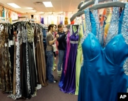 FILE - Girls shop for prom dresses at Angelique's in Saugus, Massachusetts, March 17, 2009.