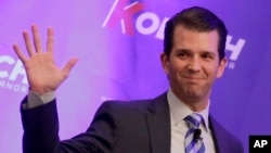 Donald Trump Jr. waves to the audience during a fundraiser for Kansas Secretary of State Kris Kobach's campaign for governor, Nov. 28, 2017.