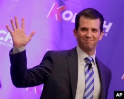 FILE - Donald Trump Jr. waves to the audience during a fundraiser for Kansas Secretary of State Kris Kobach's campaign for governor, Nov. 28, 2017.