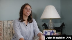 In this June 6, 2019, photo, Ashley Hull is interviewed at her family home in Pickerington, Ohio.