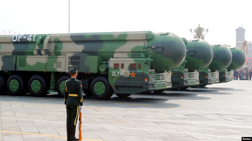 Military vehicles carrying DF-41 intercontinental ballistic missiles travel past Tiananmen Square during the military parade