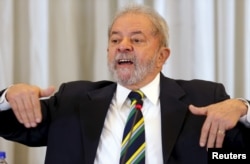 Former Brazilian President Luiz Inacio Lula da Silva reacts as he speaks during a news conference with international media in Sao Paulo, Brazil, March 28, 2016.