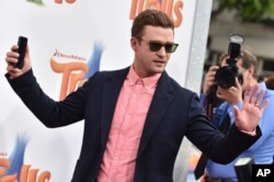 FILE - Justin Timberlake arrives at the Los Angeles premiere of "Trolls." Timberlake took a ballot box selfie that apparently violated Tennessee law. State officials say they have no plans to prosecute.
