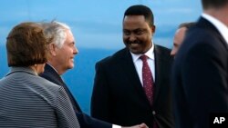 US Secretary of State Rex Tillerson (L) is greeted by Ethiopia Minister of Foreign Affairs, Workneh Gebeyehu (R) as he begins a six-day trip in Africa, after landing at Addis Ababa International Airport, March 7, 2018, Addis Ababa, Ethiopia. 