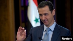 Syria's President Bashar al-Assad is seen during the filming of an interview with the BBC, in Damascus, Feb. 9, 2015.