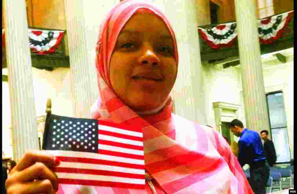 Isatu Lama Bah, originally of Sierra Leone, finally became a citizen after a long and difficult legal and bureaucratic road, New York, May 22, 2014. (Adam Phillips/VOA)