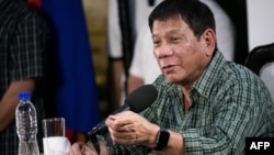 Then Philippines' president-elect Rodrigo Duterte speaks during a press conference in Davao on May 31, 2016.