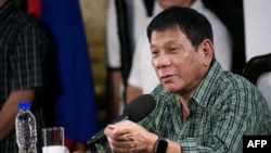FILE - Rodrigo Duterte, pictured at a press conference in May 2016, says he thinks tribunal on South China Sea claims will rule in Manila's favor, but if it doesn't, the Philippines will accept decision and abide by it.
