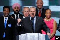 FILE - Retired Gen. John Allen stands with veterans as he speaks on the final day of the 2016 Democratic National Convention in Philadelphia, July 28, 2016.
