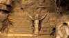 Visitors zipline at a church site in the hills near Cairo, Jan. 6, 2021. After a 70% drop in Egypt’s tourism revenue in 2020, officials focused the year on rebuilding the industry. (Hamada Elrasam/VOA)