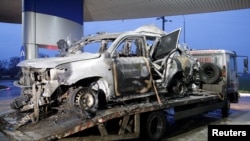 The vehicle that drove over a mine while transporting members of the Organization for Security and Cooperation in Europe (OSCE), is seen while it is moved from the scene in Luhansk region, Ukraine, April 23, 2017.