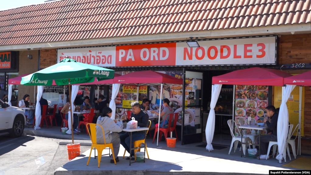People eat at the tables outside Pa Ord Noodle 3, a Thai restaurant during the coronavirus disease (COVID-19) pandemic in Los Angeles, CA. Sept 2021.