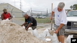 Gulfport, Mississippi, residents shovel sand into bags, preparing for Subtropical Storm Alberto to make its way through the Gulf of Mexico, May 26, 2018.