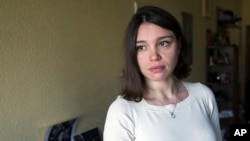 FILE - Zhanna Nemtsova, daughter of slain Russian opposition politician Boris Nemtsov, speaks to the Associated Press in Moscow, Russia, May 13, 2015. 