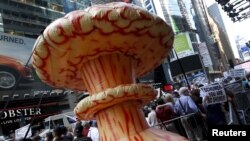 An inflatable mushroom cloud stands among demonstrators during a rally apposing the nuclear deal with Iran in Times Square in the Manhattan borough of New York City, July 22, 2015. 