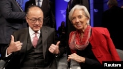 World Bank President Jim Yong Kim and International Monetary Fund Managing Director Christine Lagarde attend the Development Committee meeting during the IMF/World Bank spring meeting in Washington, April 21, 2018.