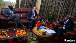 U.N. Under-Secretary General for Political Affairs Jeffrey Feltman (C) talks with the Speaker of the Somali Parliament Osman Jawari (R), at Villa Somalia in the capital Mogadishu, in this handout photo taken and provided by the African Union-United Nation