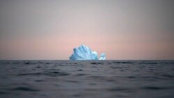 In this Aug. 15, 2019, file photo, a large Iceberg floats away as the sun sets near Kulusuk, Greenland. (AP Photo/Felipe Dana, File)