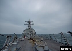 United States Navy Arleigh Burke-class guided-missile destroyer USS John Finn (DDG 113) transits the Taiwan Strait March 10, 2021 in this handout provided by the U.S. Navy. (Jason Waite/U.S. Navy/Handout via REUTERS)
