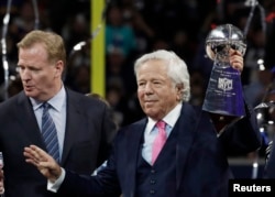 FILE - New England Patriots owner Robert Kraft celebrates with the Vince Lombardi Trophy after winning Super Bowl LIII, Feb. 3, 2019, in Atlanta, Ga.