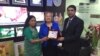 VOA Bangla Service Chief Roquia Haider and Director Amanda Bennett receive a plaque from affiliate RTV CEO Ashik Rahman in Dhaka, Bangladesh.