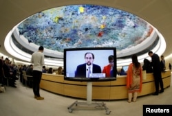 Zeid Ra'ad al-Hussein, U.N. High Commissioner for Human Rights, is pictured on a screen during his speech at the 36th Session of the Human Rights Council at the United Nations in Geneva, Switzerland, Sept. 11, 2017. Picture taken with a fisheye lens.