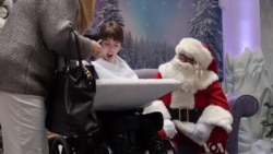 Santa Brings Christmas Joy To Deaf Children