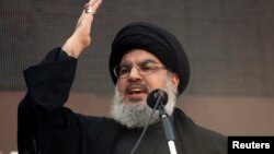 FILE - Lebanon's Hezbollah leader Sayyed Hassan Nasrallah addresses his supporters during a religious procession to mark Ashura in Beirut's suburbs, Nov. 14, 2013. 
