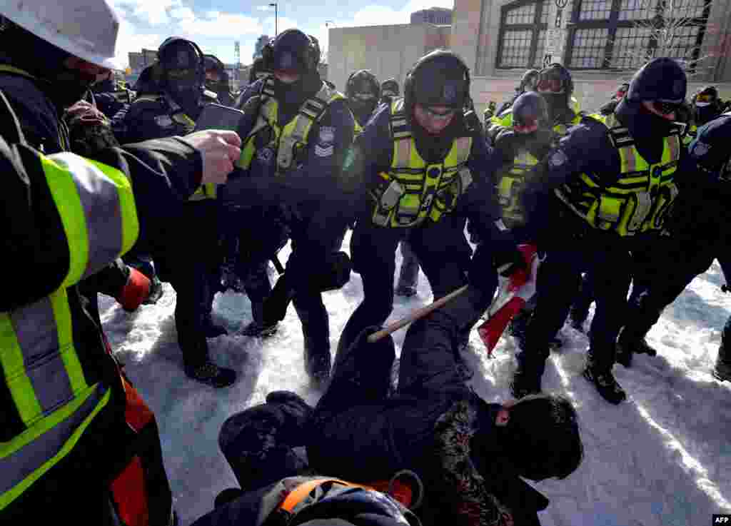 Police clash with demonstrators against COVID-19 mandates in Ottawa.