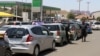 Motorists wait to buy petrol in Harare, Zimbabwe.