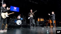 From left, the Edge, Larry Mullen, Adam Clayton and Bono perform at the 13th annual MusiCares MAP Fund Benefit Concert at the Playstation Theater in New York, June 26, 2017.