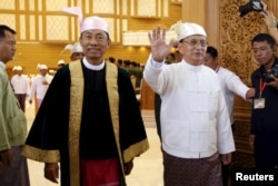 Myanmar's President Thein Sein, right, and parliament speaker Shwe Mann arrive at the Union Parliament in Naypyidaw, Jan. 28, 2016.