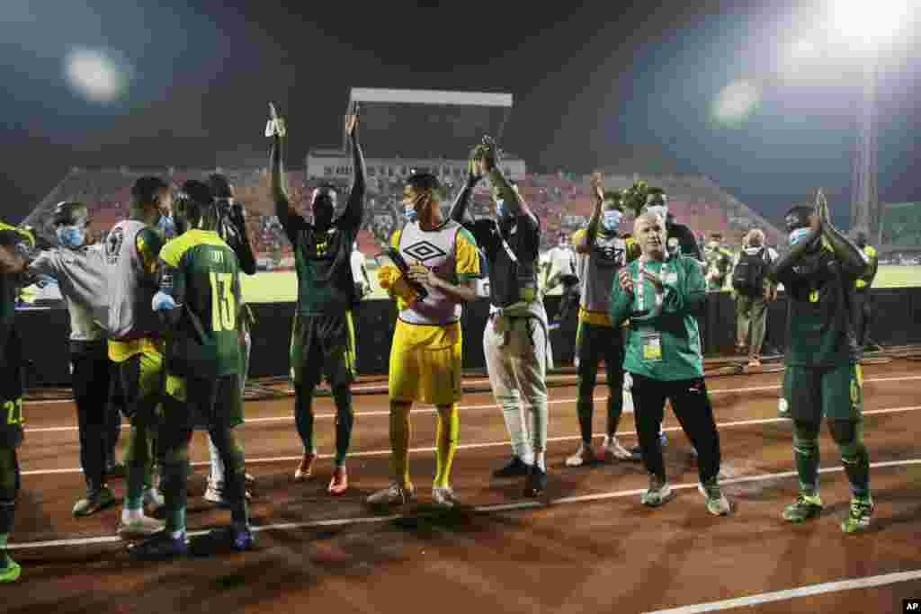 Senegalese team celebrates at the end of the round of 16 match against Cape Verde in Cameroon, Jan. 25, 2022.