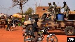 A file photo taken on Jan. 26, 2013 shows Chadian soldiers on a truck leaving Niamey for the Malian border.